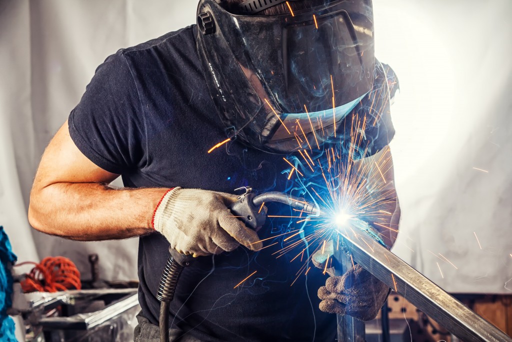 Welder with welder mask working