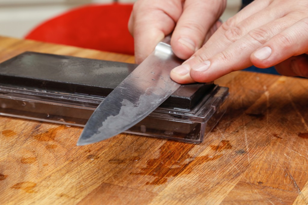 Knife being sharpened