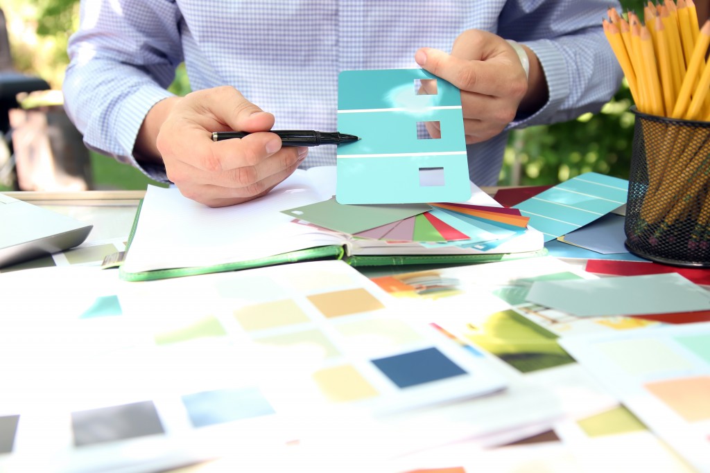 man choosing color for his design