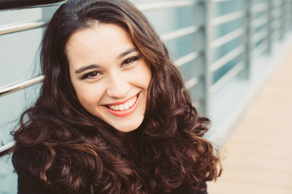 Woman with wavy hair smiling