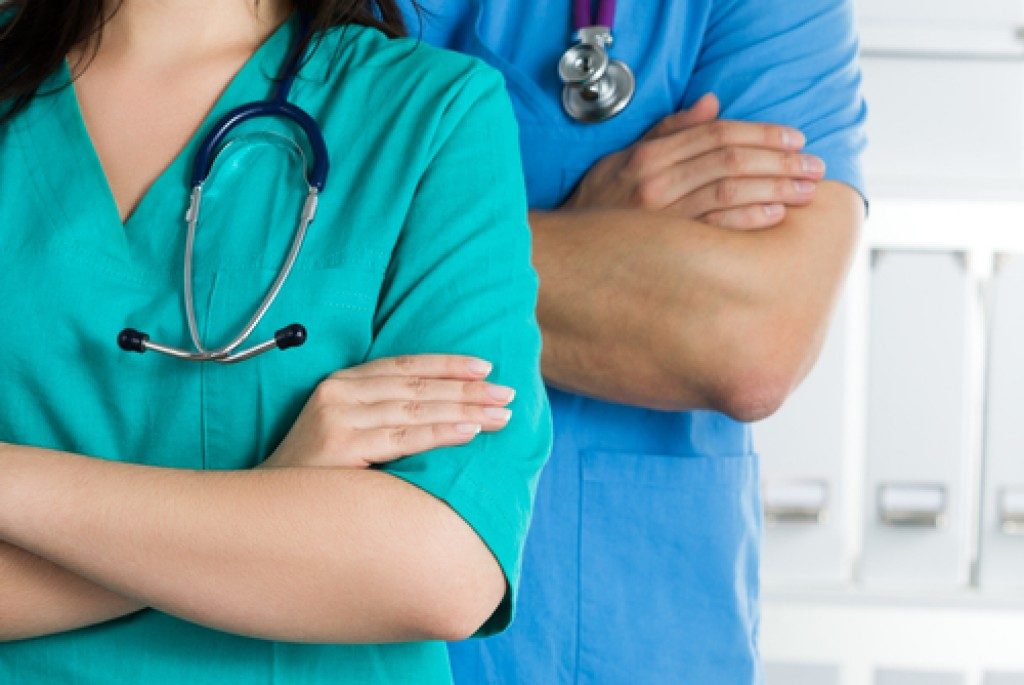 Medical staff wearing scrubs and stethoscope