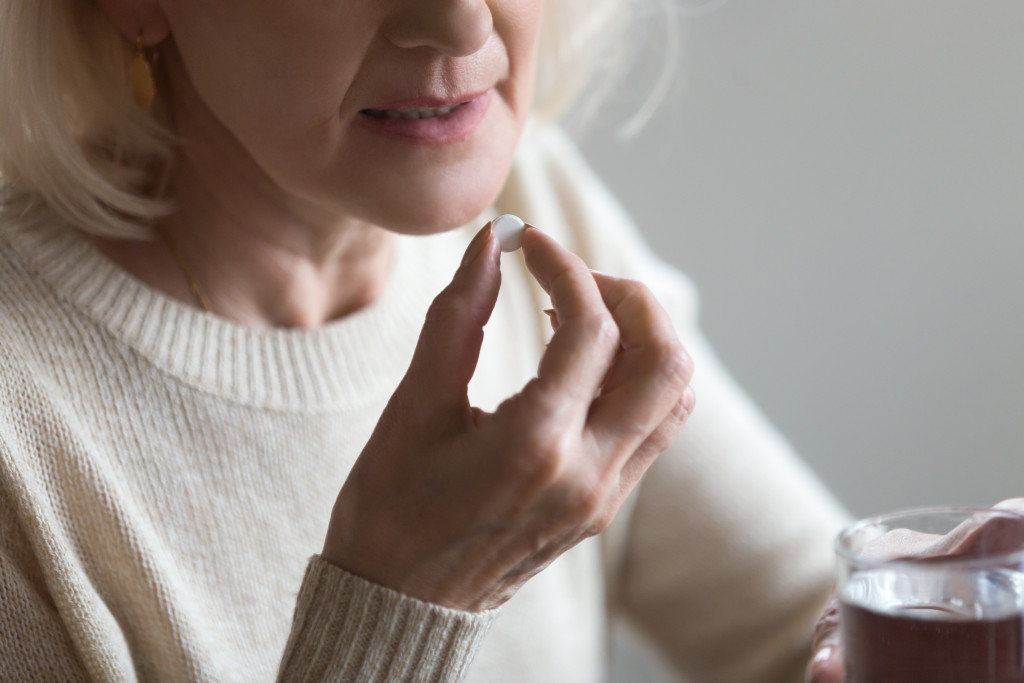 person drinking medicine