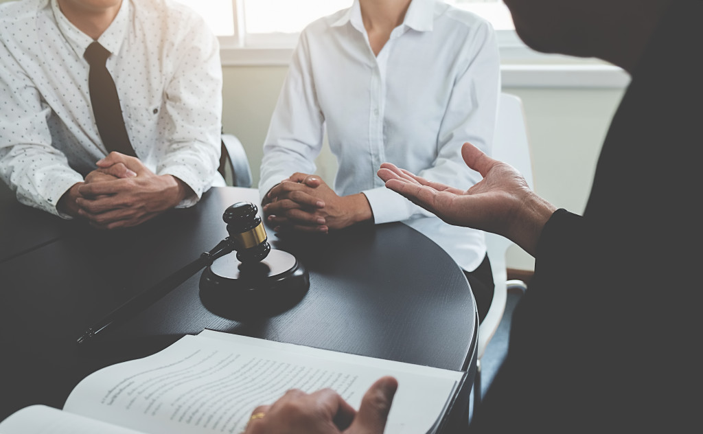 people discussing with lawyer