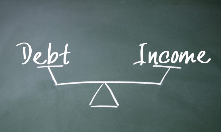 A balance sign with the words DEBT and INCOME on each side